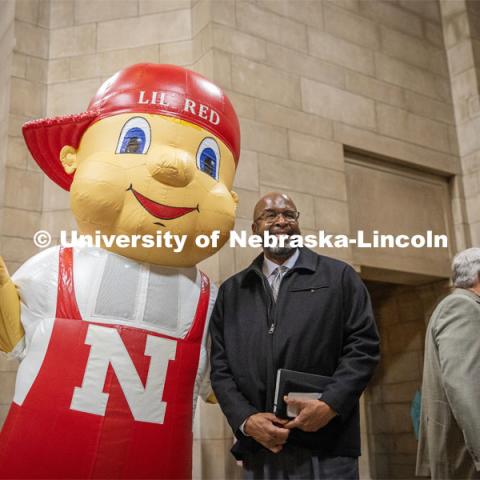 Chancellor Rodney Bennett poses with Lil Red for a picture at the I love NU event in the Nebraska State Capitol. March 6, 2024. Photo by Kristen Labadie / University Communication.